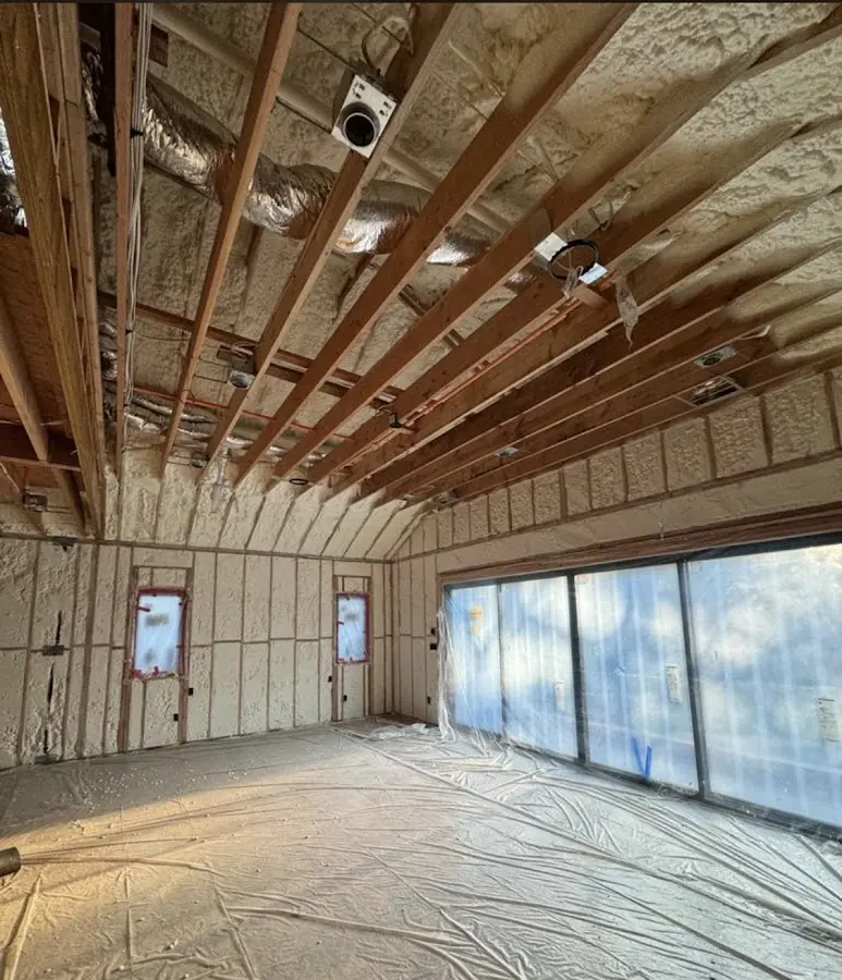 Interior walls and ceiling insulated with spray foam during new construction in North Hills